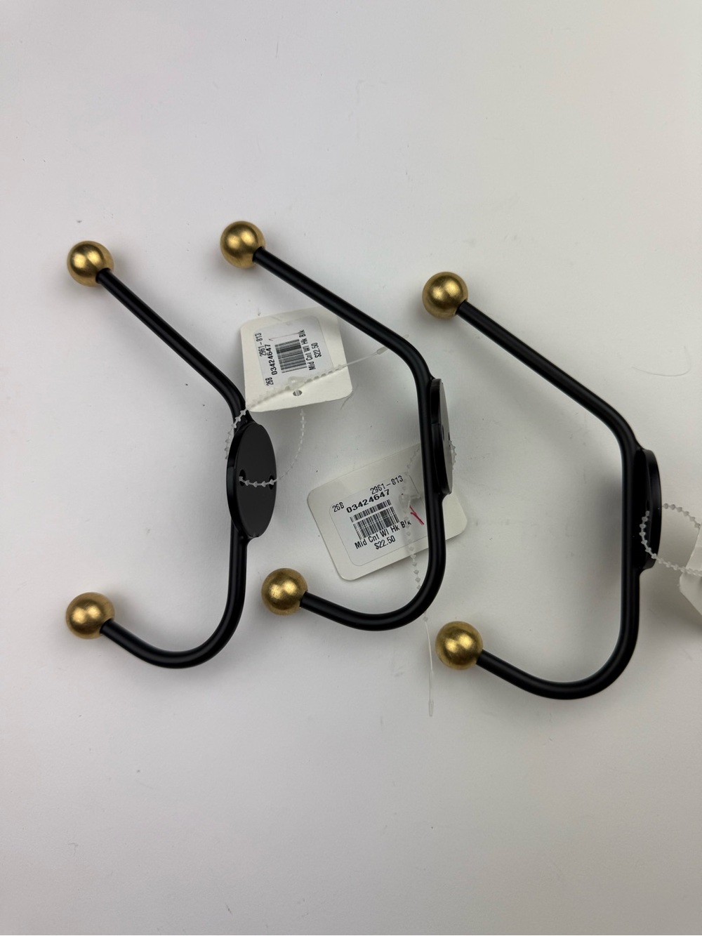 3 West Elm MCM coat hooks - black with gold balls